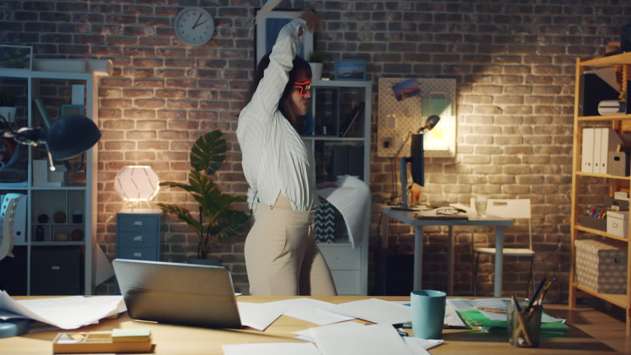 Woman Throwing Papers in Frustration at Night