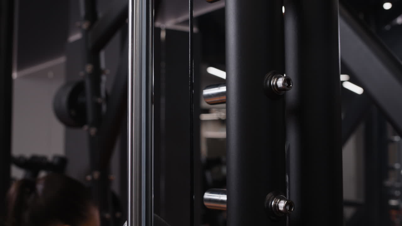 Woman Working Out on a Seated Row Machine in a Gym