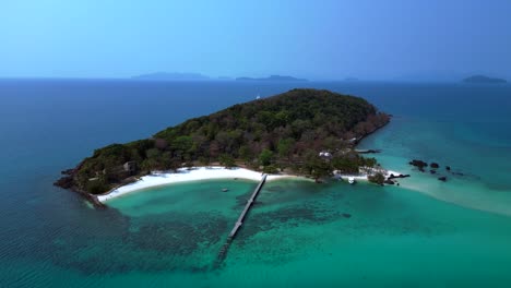koh kham island with crystal clear turquoise water, white sand beaches and lush tropical vegetation, a popular tourist destination in thailand. aerial view flight drone shot footage from above