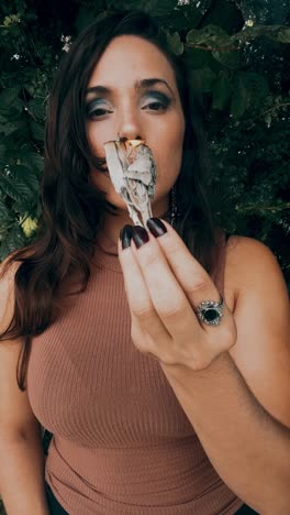 woman performing a smudging ritual