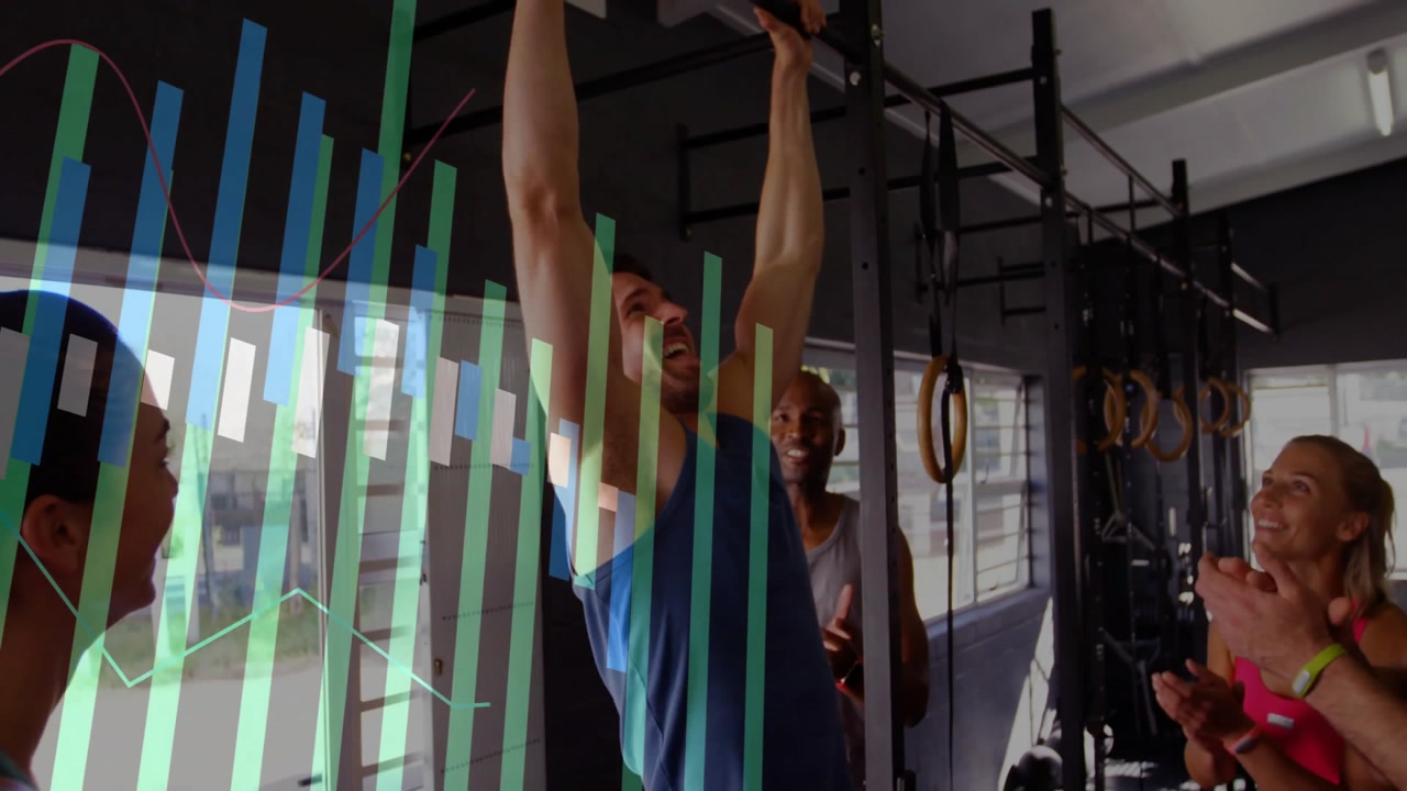 Man stepping under gym pull-up bar and gripping while friends cheering for performance graphs