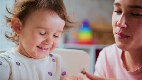 A Heartwarming Moment Between a Mother and Child, Capturing the Joyful Interactions and Tender Expressions as They Share a Special Activity Together