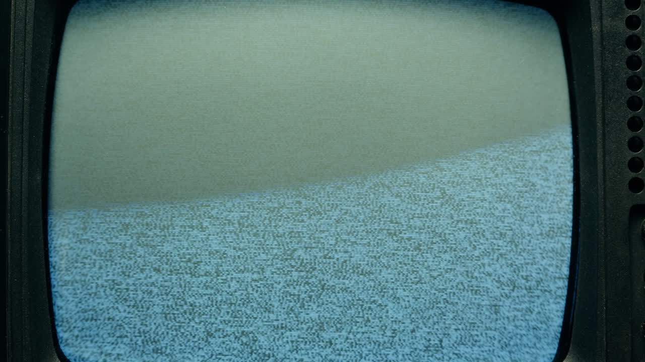 Retro Style TV Set with Green Screen chroma key background, vintage 60s analog television with grain and noise.