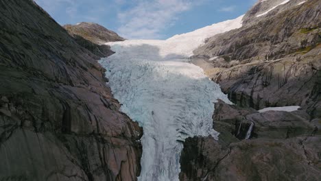 aerial view of a majestic glacier in a mountain valley