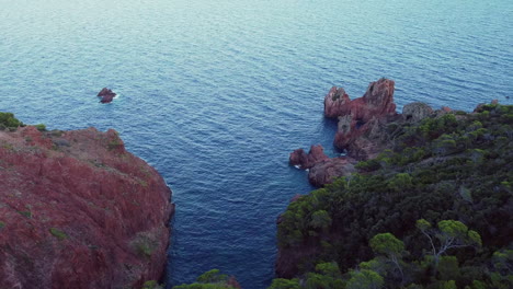 a beautiful aerial landscape of the coast of france and the golden island at sunset