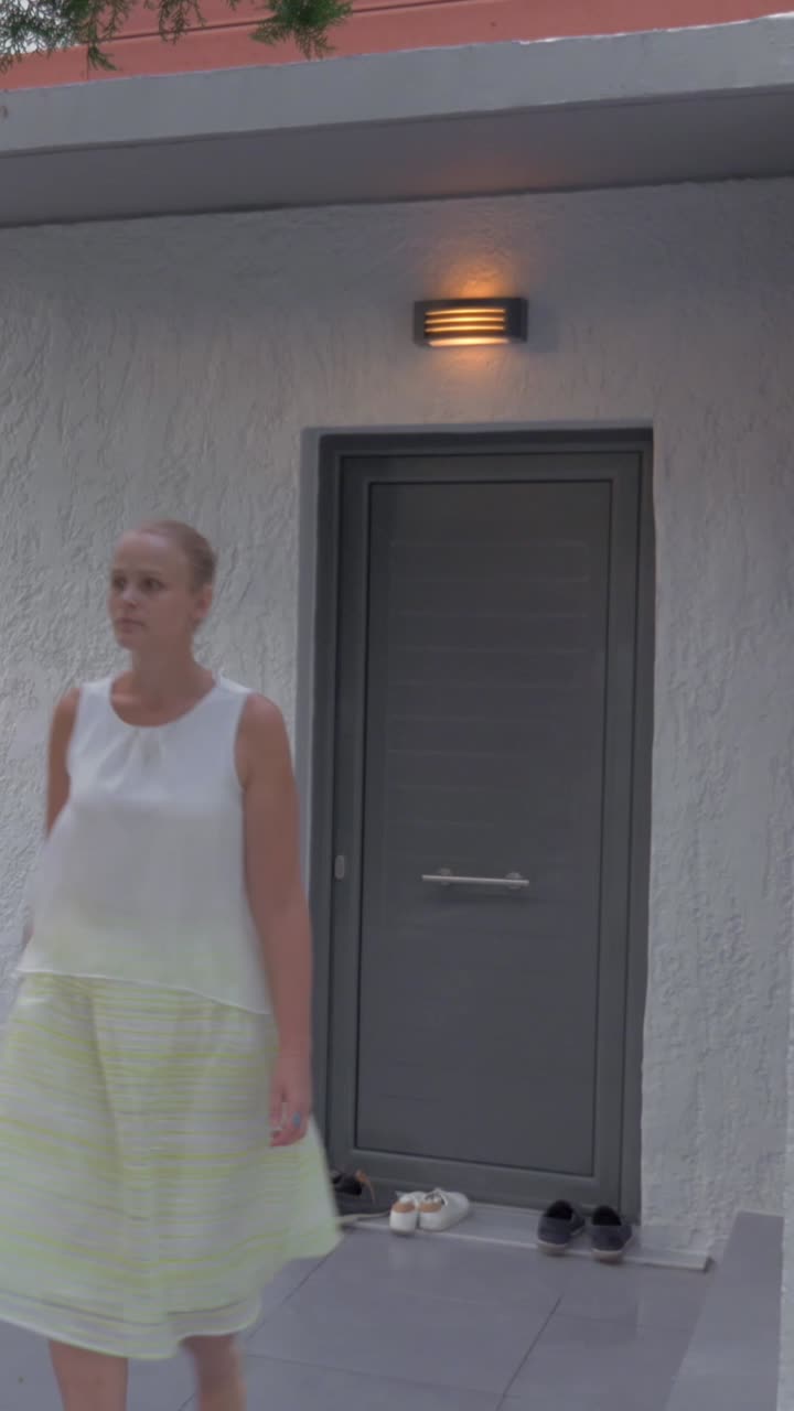 Woman standing in front of a door