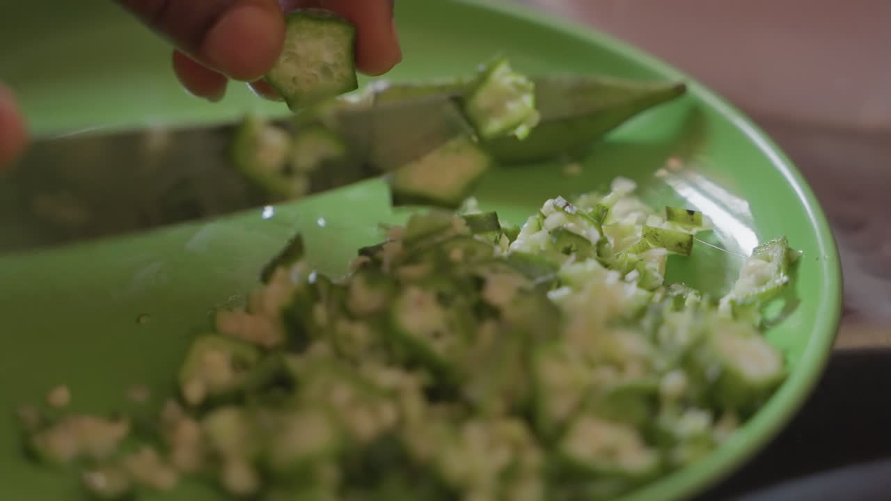 Closeup black hands slicing green pepper on plate, street vendor prep, fast pace, rustic stall kitchen, tactile texture, quick toss into bowl, seasoning ready, vibrant urban flavor, candid handheld