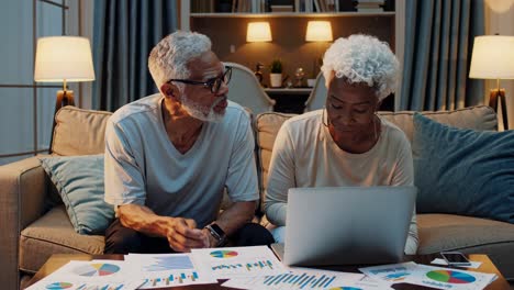 senior couple discussing finances at home