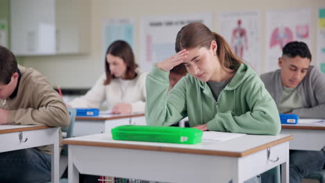 students taking a test in a classroom