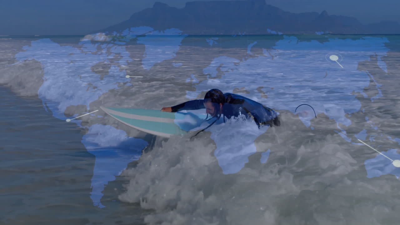 male surfer paddling on light-blue white surfboard in ocean, showing animated wave tech overlays