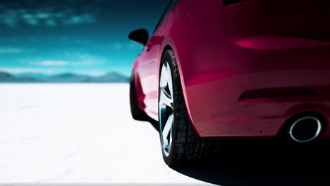 pink car on a snowy desert landscape