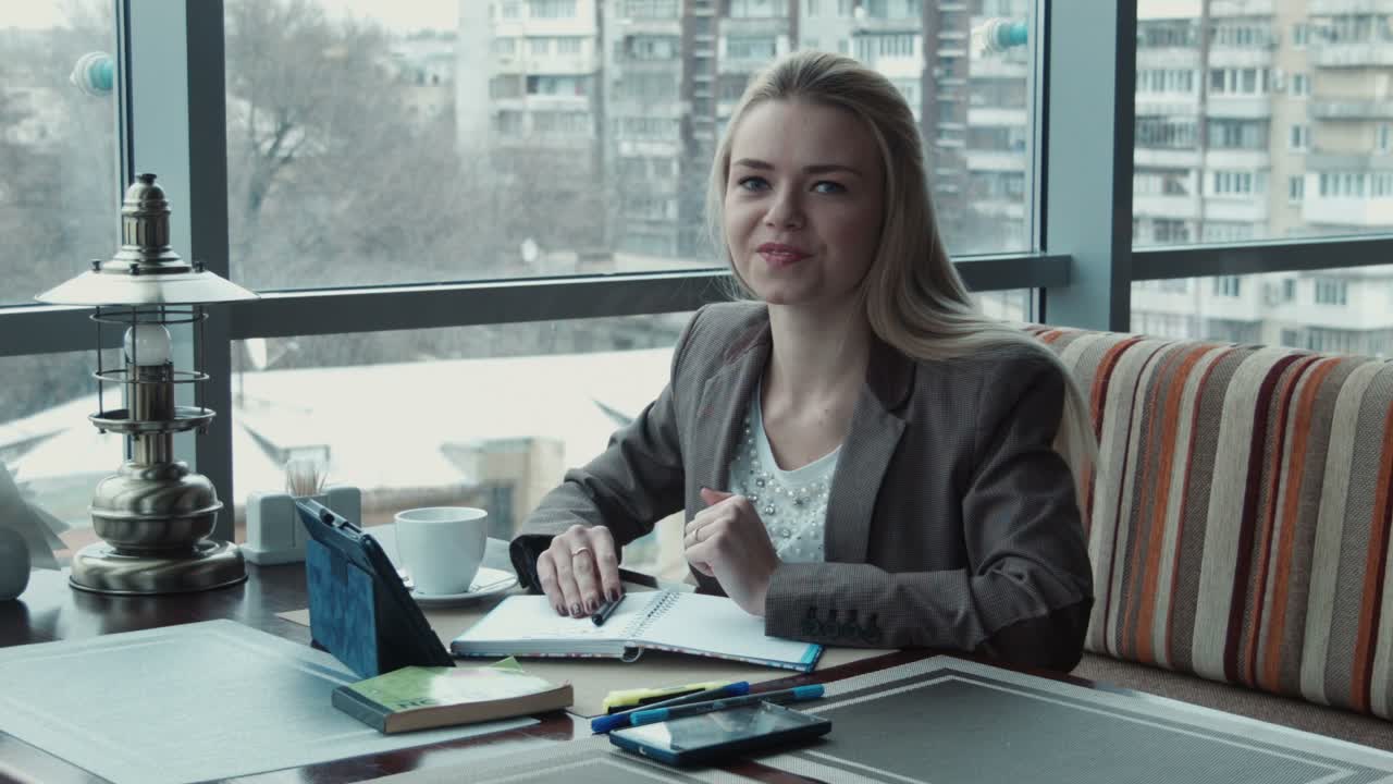 A Freelance Girl Working on a Laptop in the Summer on Campus