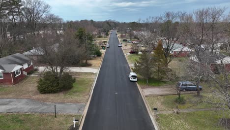 straight street in american suburb neighborhood in winter