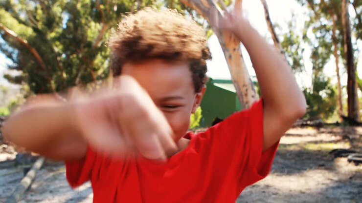 Boy dancing during obstacle course