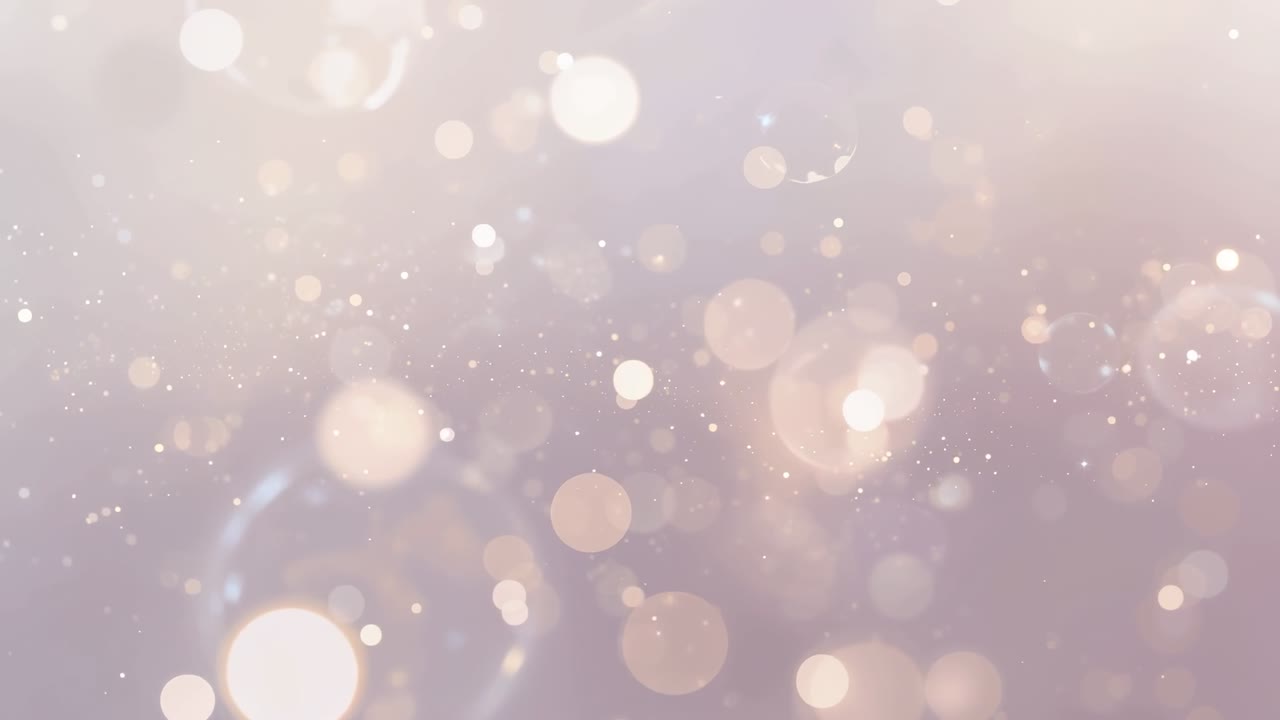 Shifting soft bokeh orb cluster and specks reacting to lighting shifts against warm pastel backdrop