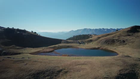 A-drone-tracks-back-the-dragonlake-of-mountain-Smolikas-at-2