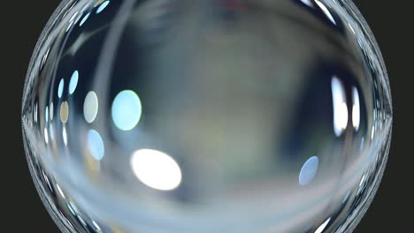 Glass effect globe bauble with bokeh lights abstract