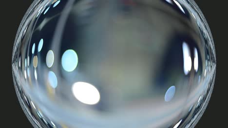 glass effect globe bauble with bokeh lights abstract