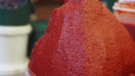 selling tomato paste at a market