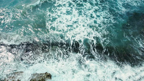 Drone-shot-of-waves-coming-to-shore-at-Treasure-Beach-in-St