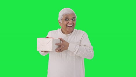 Happy-Indian-old-man-receiving-a-gift-Green-screen