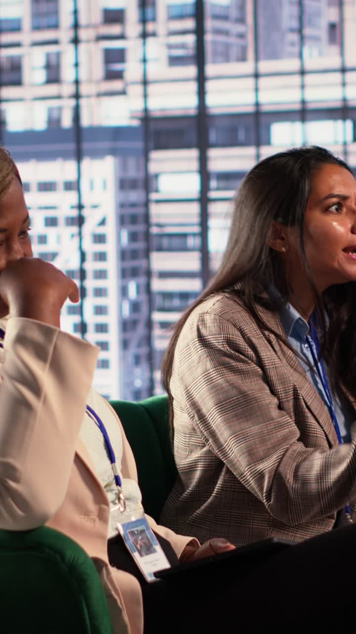 Diverse Businesswomen Engaged in Discussion at a Corporate Event