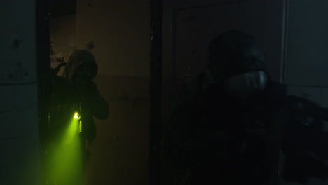 military operation in a damaged building at night
