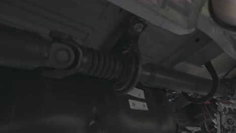 drive shaft of a 4x4 van moving toward the transfer case, transmission