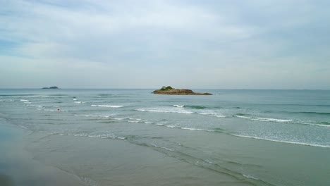 Beautiful-waves-filmed-with-Drone-on-a-quiet-beach-in-Guarujá,-Brazil