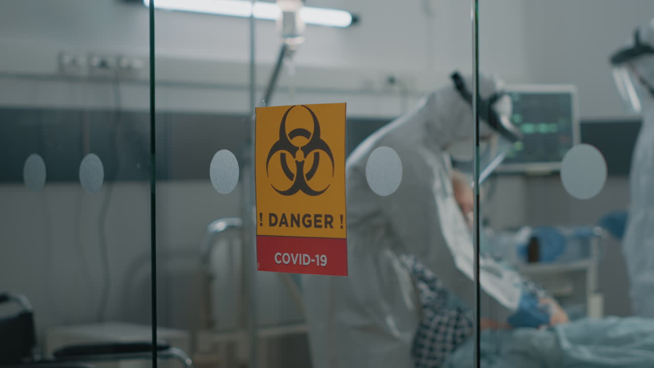 Hospital ward in coronavirus quarantine with danger sign