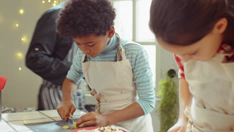 children cutting mushrooms on cooking masterclass