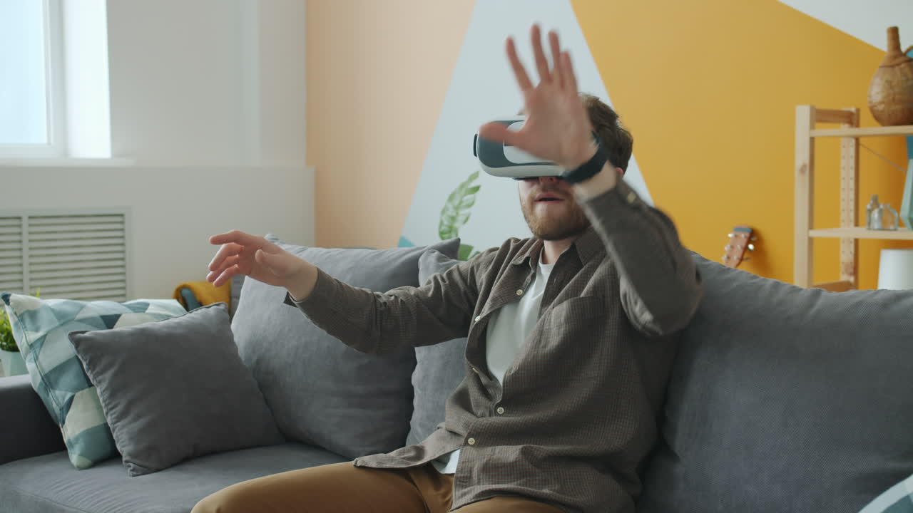 Man Experiencing Virtual Reality on a Couch