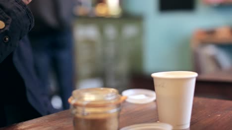 man drinking coffee in coffee shop