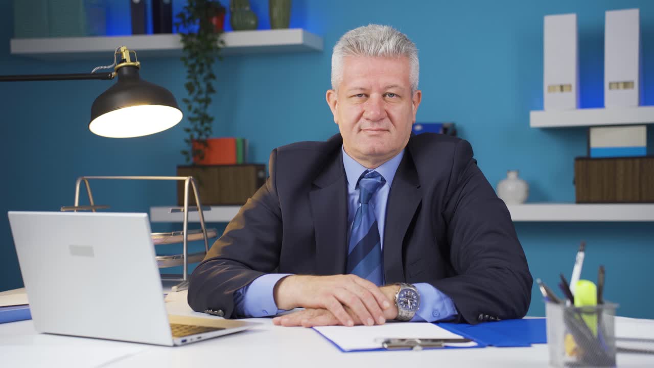 Businessman winking at camera.