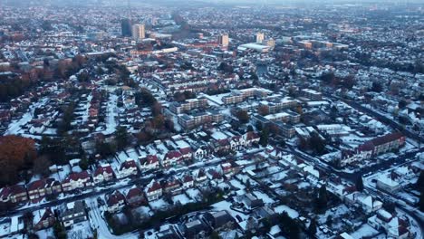Aerial-view-city-in-England-covered-in-white-snow-during-Christmas