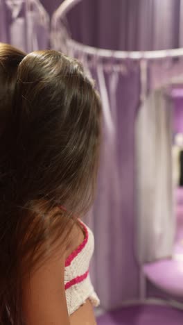 woman in a purple fitting room