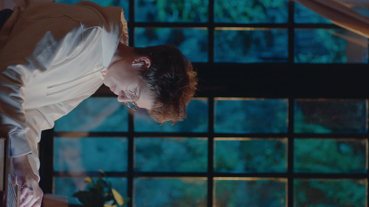 Girl Working on Laptop at Home Late at Night