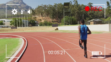 animation of digital data processing over disabled male athlete with running blades on racing track