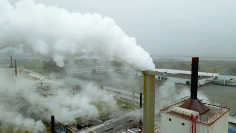 smoke from a chimney of a fiber glass factory called neg nippon electric glass