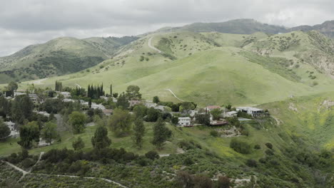 Flying-towards-green-hills-in-nice-neighborhood