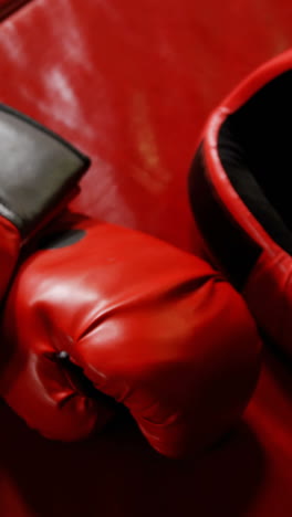 boxing gloves and headgear in boxing ring