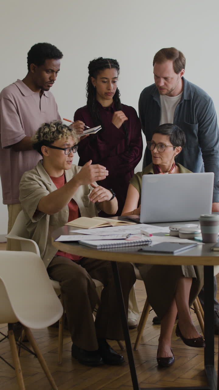 Diverse Team Collaborating on a Project in an Office