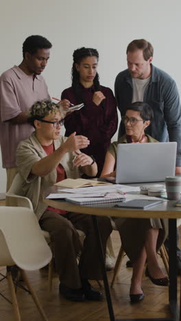 diverse team collaborating on a project in an office