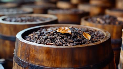 wooden barrels full of tea leaves