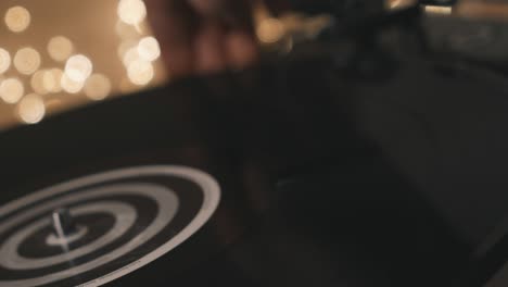 turntable vinyl record player. defocus in focus included gramophone and torque plate close-up on a light background. stylus with a needle close-up against a backdrop of bright bokeh