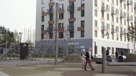 city park with apartment building in background