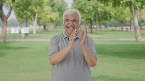 Happy-Indian-old-man-clapping-and-appreciating-in-park