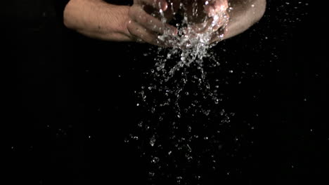 water falling onto hands