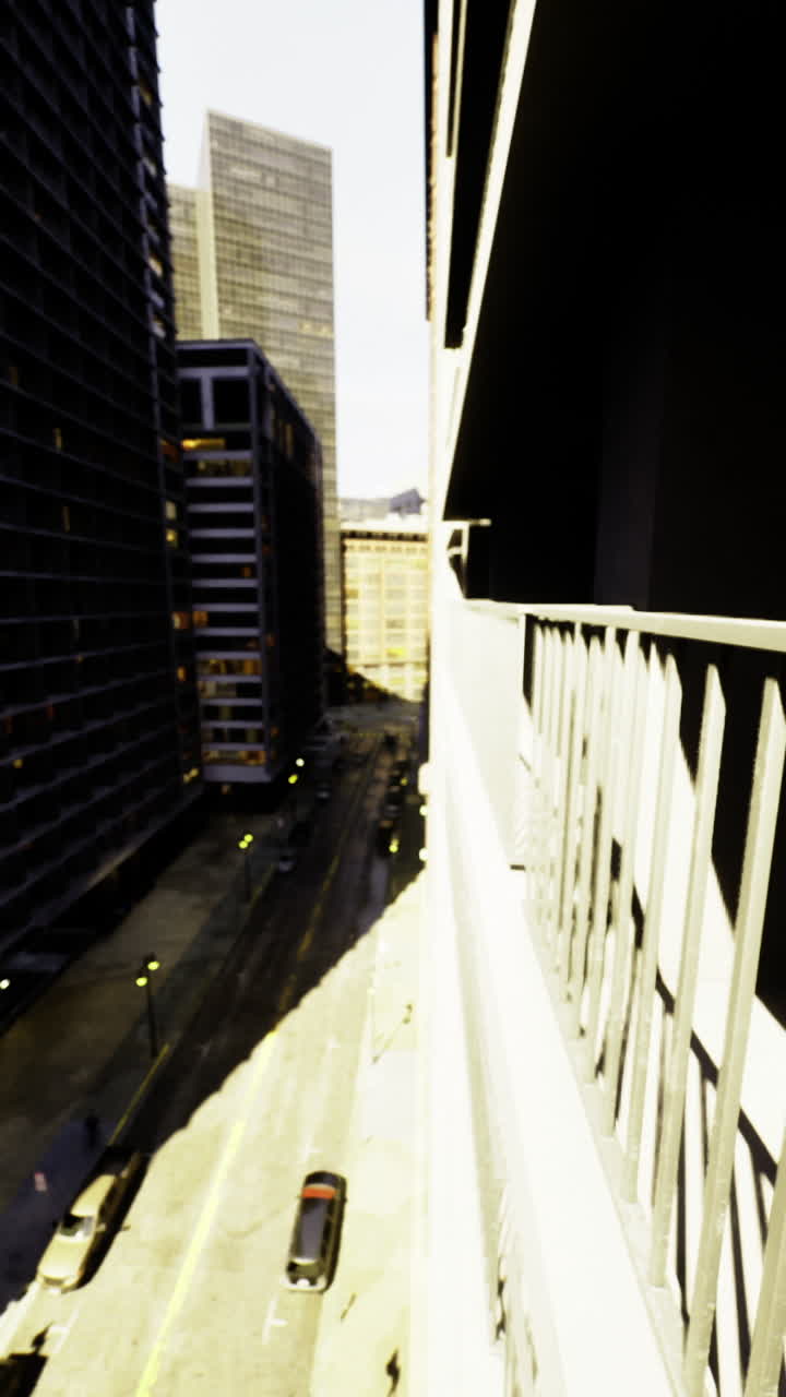 Urban balcony view overlooking a bustling street under bright sunlight