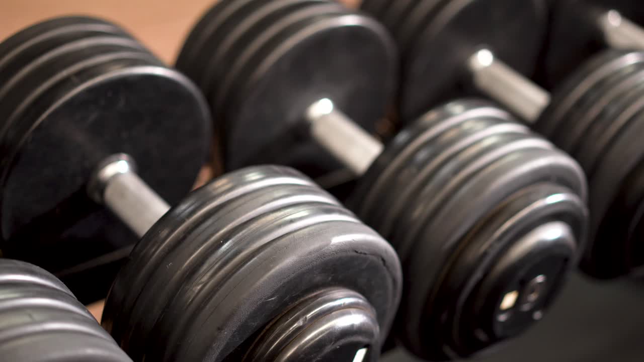 Close-up of dumbbells in a gym